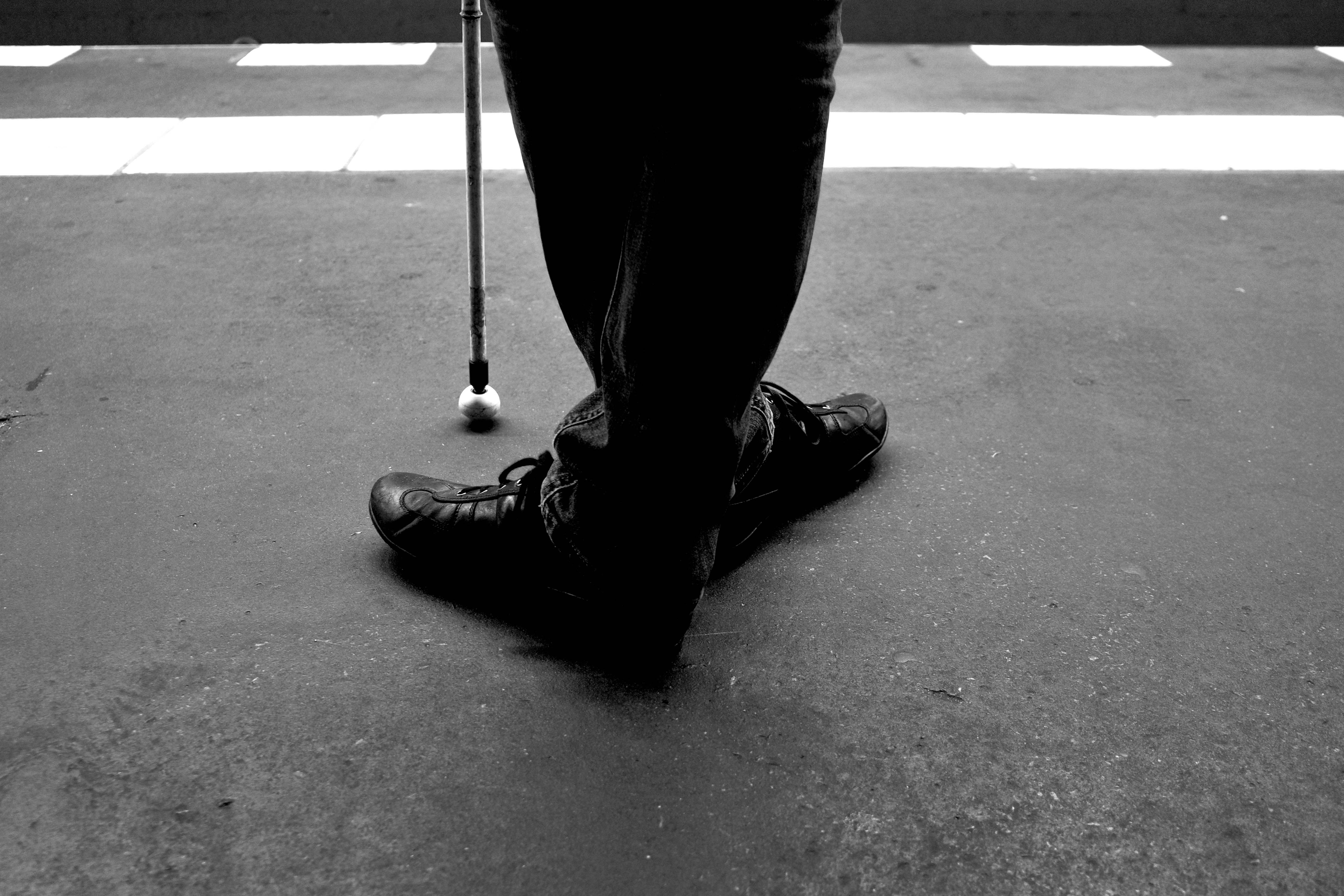 A black and white photo of a person holding a golf club